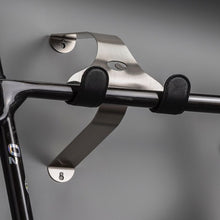 Load image into Gallery viewer, Cactus Tongue SSL Roadie bike hanger with black leather sleeves holding a shiny black o2 road bike