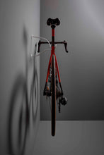 Load image into Gallery viewer, Rear of Colnago V3rs bike hanging on a Cactus Tongue AIR hanger showing the side view of the bike hanger