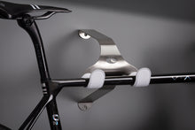 Load image into Gallery viewer, Cactus Tongue SSL Roadie bike hanger with white leather sleeves holding a Factor O2 VAM