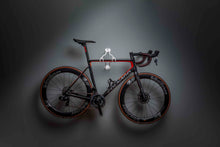 Load image into Gallery viewer, Full side on view of a colnago V3rs stored on a Cactus Tongue AIR Roadie bike hanger. Lighting is from above focussing on the hanger and bike
