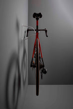 Load image into Gallery viewer, Rear of Colnago V3rs bike hanging on a Cactus Tongue AIR hanger showing the side view of the bike hanger
