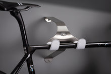 Load image into Gallery viewer, Cactus Tongue SSL Roadie bike hanger with white leather sleeves holding a Factor O2 VAM
