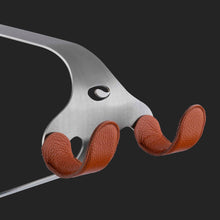 Load image into Gallery viewer, Cactus Tongue SSL bike hanger with orange leather sleeves
